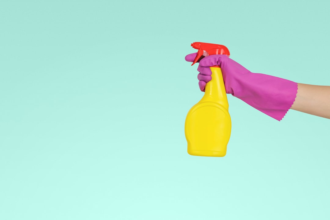 hero-img person-holding-yellow-plastic-spray-bottle-zmnefoi3k